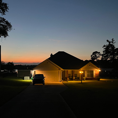 night shot of floodlights on a home