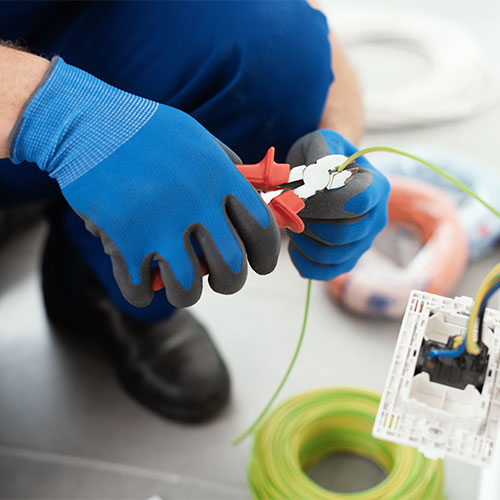 Professional electrician working on the electrical system
