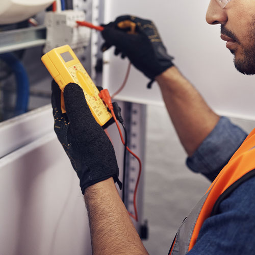 Technician, man and multimeter testing power for electricity, energy inspection and electrical system