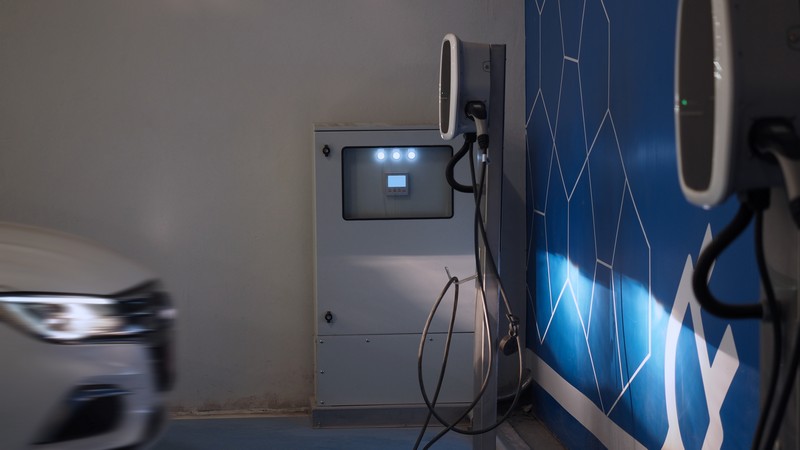EV Charger quick charge type at car parking which DC Charging faster than AC system. EV Charger car station charging use AC socket plug for electric engine vehicle. Future transport energy technology